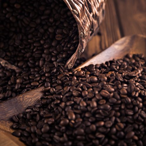 roasted-coffee-beans-close-up-on-a-wooden-surface.jpg